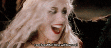 Movie gif. Sarah Jessica Parker as Sarah in Hocus Pocus. She is enraptured with herself as she grins and touches her head, smiling upwards and closing her eyes while saying, "I am beautiful! Boys will love me!"