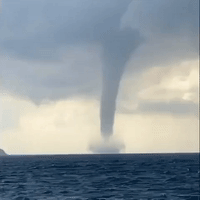 'Oh My God': Waterspout Towers Near Tourists on Greek Isle of Santorini