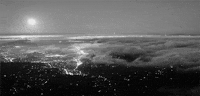 partly cloudy city GIF