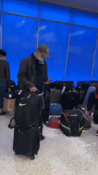 Passengers Face 'Ocean of Luggage' at New York's JFK Airport Amid Flight Disruption