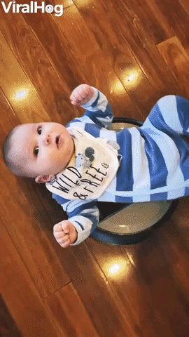 Baby Laying on a Roomba