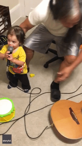 Toddler Sings Along as Grandad Plays Guitar in Touching Duet