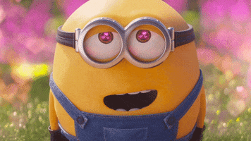 Cartoon gif. Bob from Minions: Rise of Gru is staring at something and he's fallen in love. His eyes are filled with hearts and they go half-lidded as he stares with his body completely limp.
