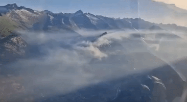 Helicopters Join Firefighting Effort as Wildfire Spreads in Swiss Alps