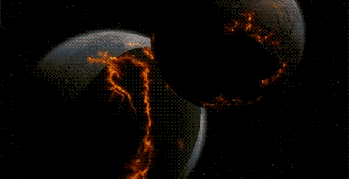 Video gif. Two dark planets collide in a fiery explosion that radiates with a ring of flames and rubble.