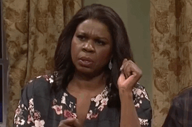 SNL gif. Leslie Jones has her hand up as she looks back and forth in confusion, wondering if she's the only person hearing or seeing what's going on. 