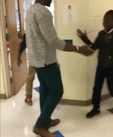Teacher Shows off Epic Handshakes with Students