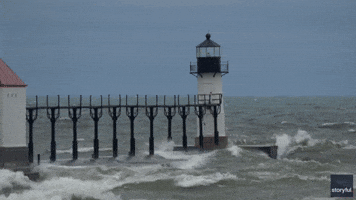 Large Waves Slam Michigan Lighthouse as Chilly Temperatures Move Through Region