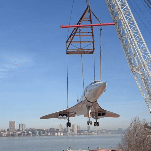 Concorde Jet Lifted by Crane Onto Museum Pier 