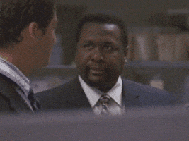 TV gif. Actor Wendell Pierce as Bunk Moreland on The Wire shakes his head in frustrated disappointment and walks away. 