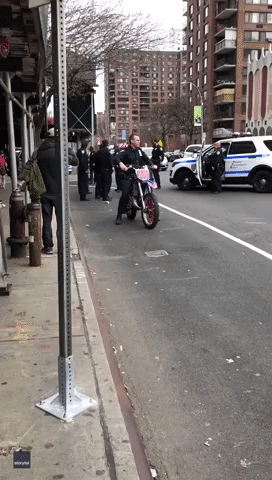 NYPD Officer Falls Off Dirt Bike at New York City Intersection