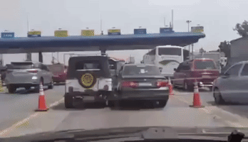 Cars Refuse to Give Right of Way at Toll Booth Entrance