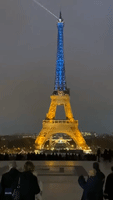 Eiffel Tower Lights Up in Blue and Yellow Ahead of First Anniversary of Ukraine War