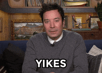 Tonight Show gif. Jimmy Fallon rests his elbows on his legs and squints as he says, "Yikes."