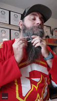 World Record Breaker Fits 110 Candy Canes in Beard