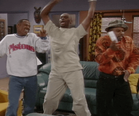 TV gif. Three men, Martin Lawrence as Martin, Thomas Mikal Ford as Tommy, and Carl Anthony Payne II as Cole on Martin, dance, happy and excited, in the living room, celebrating. 