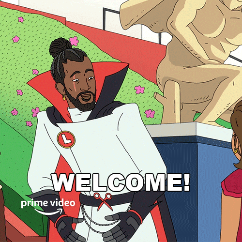 Cartoon gif. Dressed in a white coat and a red-and-black cape, Hiroki Hassan from Fairfax opens his arms and smiles, saying "Welcome!" which appears as text.