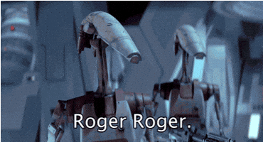 Star Wars gif. Two battle droids looking forward, holding big guns, nod in agreement. Text, "Roger roger."