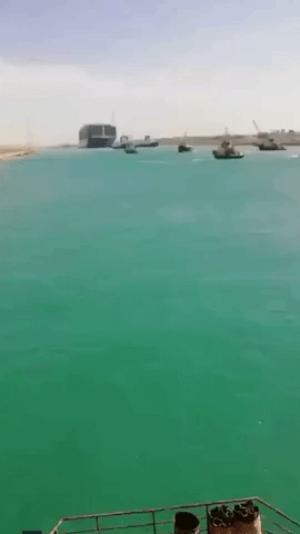 Boats Honk and Crew Cheers for Refloated Ship in Suez Canal