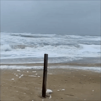 Wind Sends Sea Foam Flying as Storm Approaches North Carolina's Outer Banks