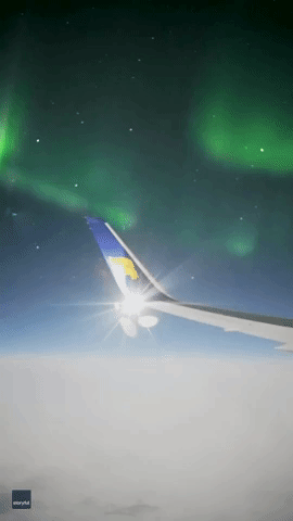 Plane Passenger Films Bright Green Aurora Over Greenland