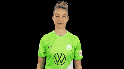Sports gif. Felicitas Rauch of VFL Wolfsburg balls her hands into fists and holds them in a fighter's position while grinning from ear to ear. 