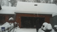 Snow Cascading Off Michigan Home Is the Most Satisfying Thing You'll See Today