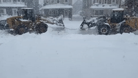 Plow Stuck in Several Feet of Snow Amid Buffalo Blizzard