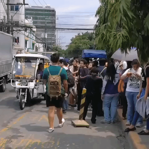 People Line Streets After Earthquake Hits Manila