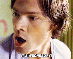 TV gif. Looking to the side, Jared Padalecki as Sam in Supernatural says "It's Wednesday!" which appears as text, and then looks upward with astonishment.