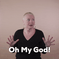 Reaction gif. A white woman with invisible disabilities, with hair styled in a sleek platinum pixie cut and big hoop earrings hands up fingers flexed in alarm, looks at us and says, "Oh my god, Run!"