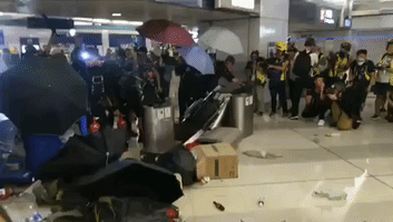 Makeshift Barricade Erected at Hong Kong's Yuen Long Station as Protesters Face Police