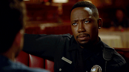 TV gif. Lamorne Morris as Winston Bishop in New Girl is in his cop uniform, and his eyes slide from side to side while he furrows his eyebrows in deep thought.