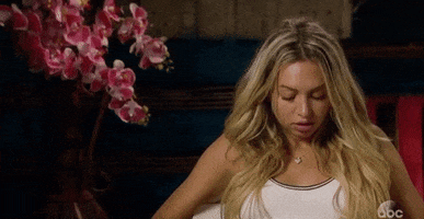 Reality TV gif. Talking head of Corinne from the Bachelor as she rolls her eyes and throws her head back dramatically, exasperated.