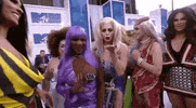 Celebrity gif. Five or six drag queens on the red carpet at the 2016 VMAs.
