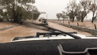 Cars Navigate Flooded Oxley Highway After Torrential Rain Falls in New South Wales