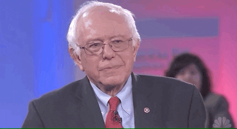 TV gif. Senator Bernie Sanders during a debate looks up and rolls his eyes mockingly, exclaiming “Oh!”