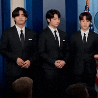 V and Jungkook react during press conference.