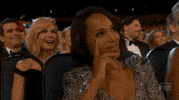 TV gif. Sitting in the audience at the Emmys, Kerry Washington shakes her head in disapproval.