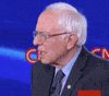 Political gif. In front of a blue CNN backdrop, Bernie Sanders is taken aback and looks around in disbelief.