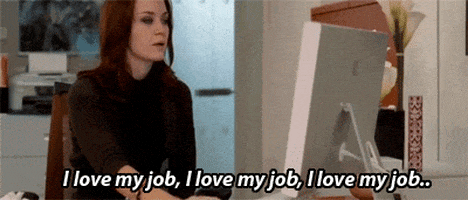Movie gif. Emily Blunt as Emily Charlton in Devil Wears Prada sits at her desk, looking at her computer. She has a blank expression on her face as she says, “I love my hob, I love my job, I love my job.”