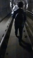 Kyoto Commuters Walk in Dark Tunnel After Quake Disrupts Train Services