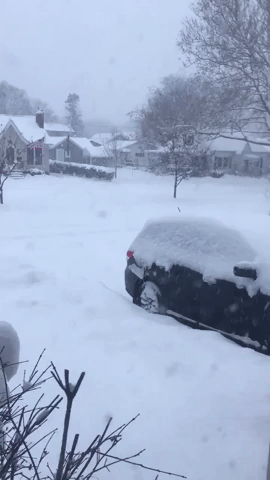 Snow Blankets Streets and Cars in Iowa