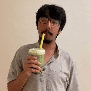 Drinking matcha boba milk tea