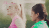 TV gif. Alice Felgate as Amber Dean in Some Girls stretches outside next to another girl and smiles. She quickly stops smiling and glares at the girl, who looks disgusted, as they continue stretching. Text, "Oh."