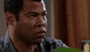 TV gif. Jordan Peele on Key and Peele looks to the side with a serious expression on his face. He is sweating profusely and water drips down his face.