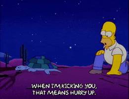 kicking homer simpson GIF