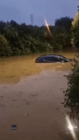 Bus Drives Through Deep Floodwaters in Auckland