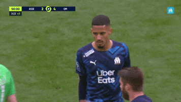 Sports gif. The Olympique De Marseille soccer team all give one another high fives and fist bumps, congratulating each other.