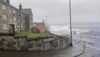 Waves Whipped Up by Storm Brendan Crash Across Road in Scotland